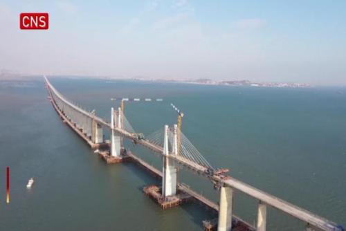 Bridge sections joined on China's first cross-sea high-speed railway