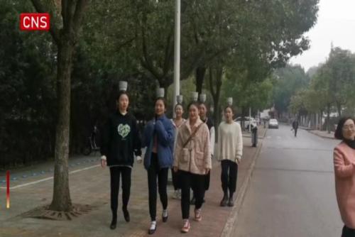Hubei university: Dance students 'live' with bowls on head