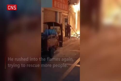 Policeman runs into fire twice to save people