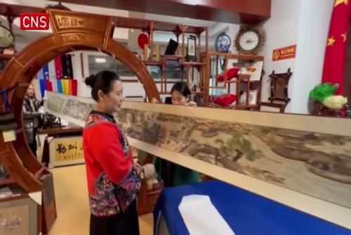 Miao women finish 7.2-meter-long embroidery masterpiece