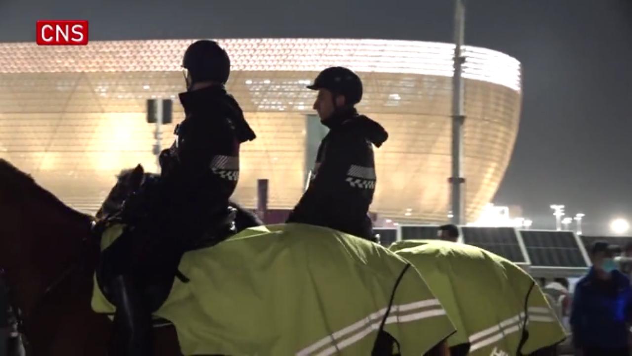 Doha police on horseback patrol outside Lusail Stadium