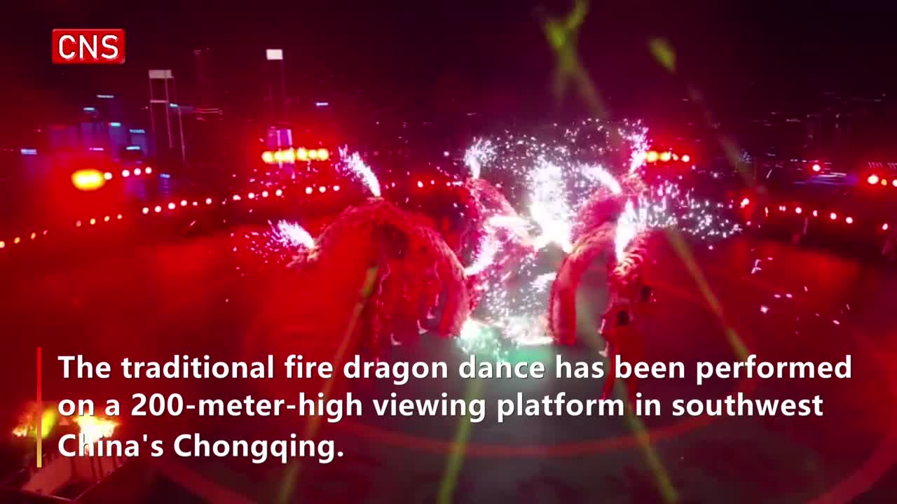 Traditional fire dragon dance performed on 200-meter-high viewing platform