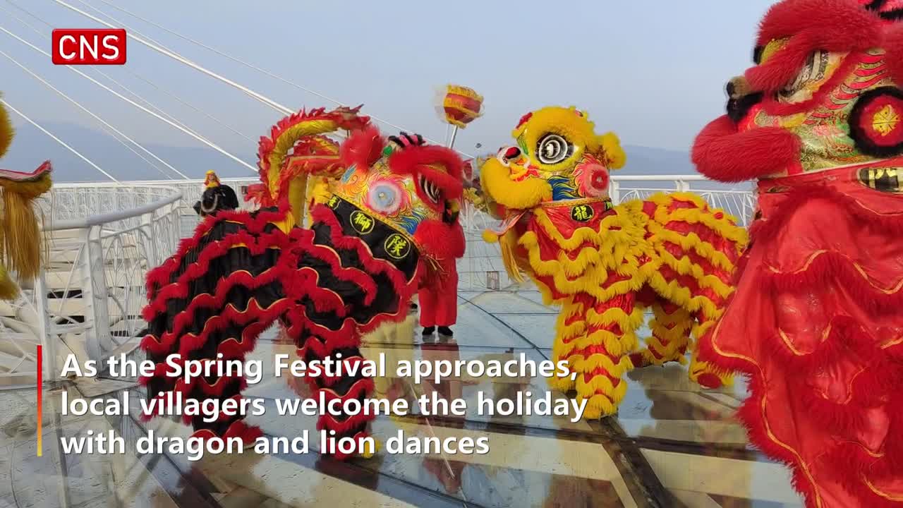 People perform dragon and lion dances to welcome the Spring Festival