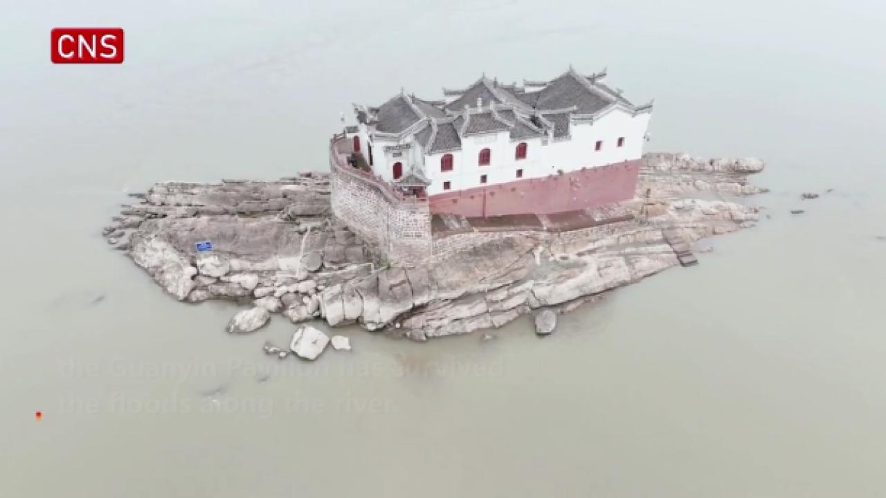 Aerial view of 700-year-old Guanyin Pavilion standing in Yangtze River