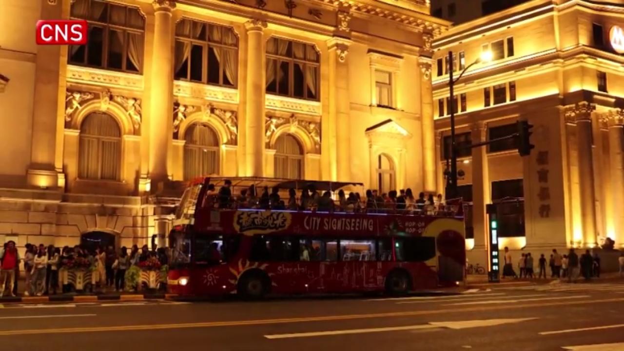 Shanghai's open-air double-decker buses bid farewell to passengers