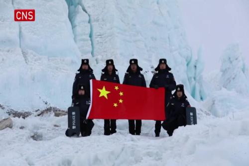 Officers patrol on glacier at China's highest border police station