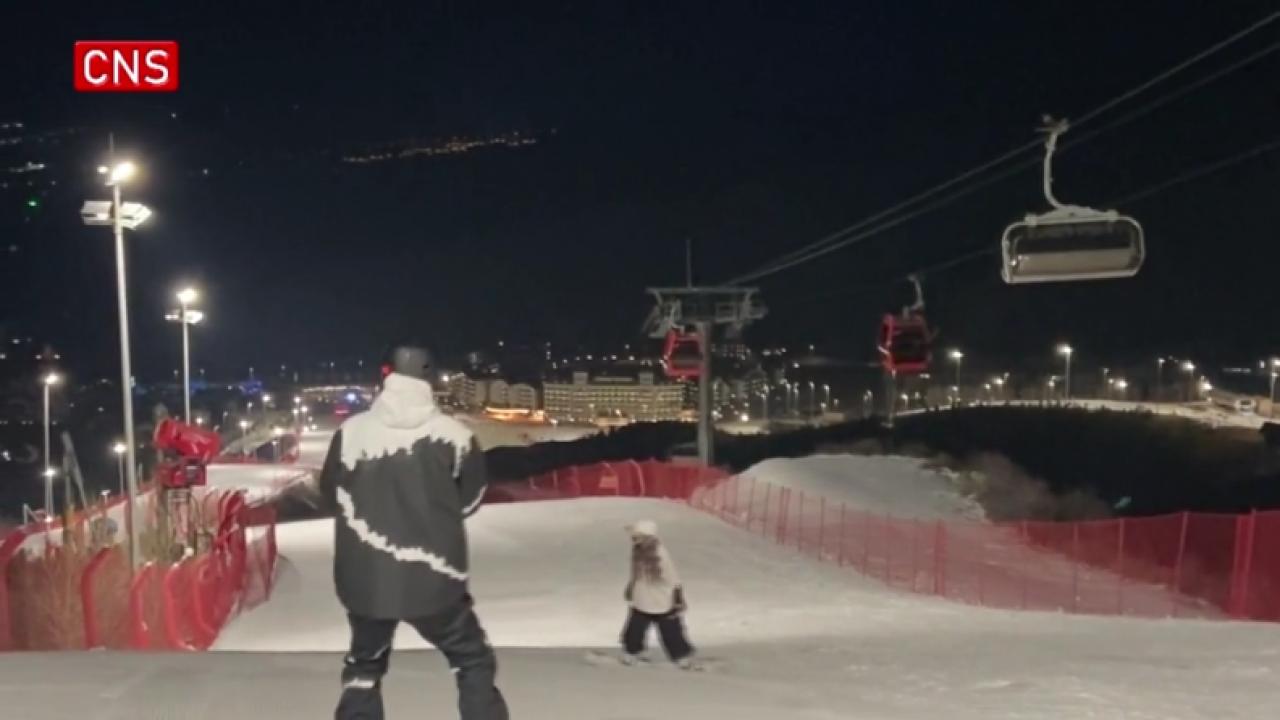 Visitors across China flock to ski resort opening at night in Chongli