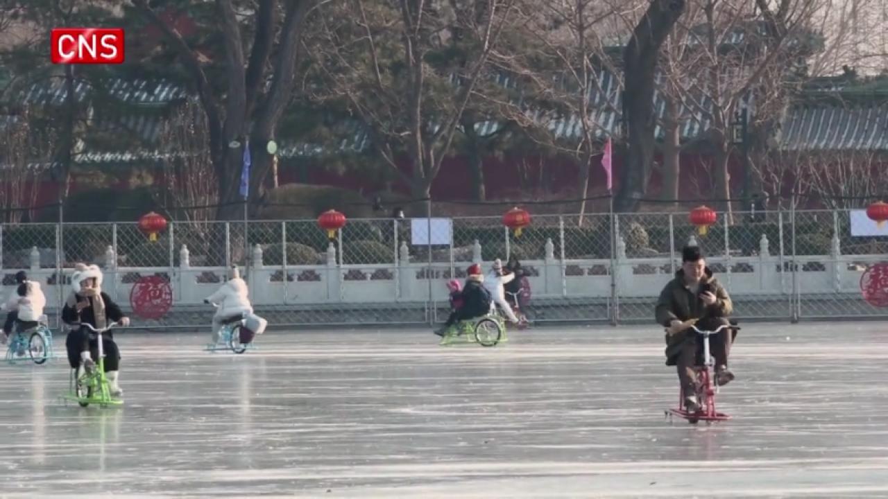 People enjoy themselves on frozen Shichahai Lake in Beijing