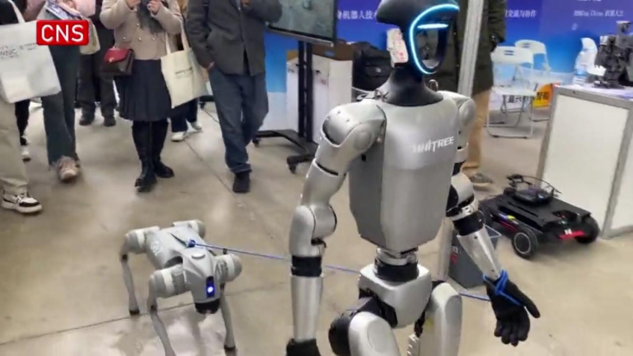Humanoid robot walking robotic dog wows visitors at 2025 Global Developer Conference